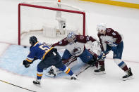 St. Louis Blues' David Perron, left, scores past Colorado Avalanche goaltender Darcy Kuemper (35) and Cale Makar (8) during the first period in Game 4 of an NHL hockey Stanley Cup second-round playoff series Monday, May 23, 2022, in St. Louis. (AP Photo/Jeff Roberson)