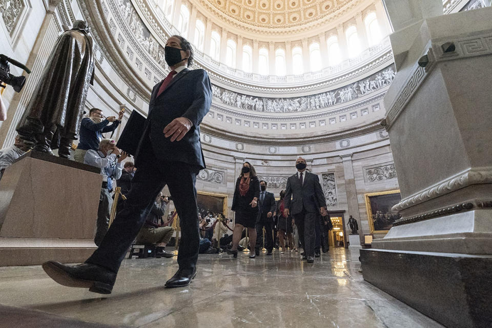Rep. Jamie Raskin, D-Md., left, the lead Democratic House impeachment manager, and other impeachment managers, walk through the Rotunda to the Senate for the second impeachment trial of former President Donald Trump, Tuesday, Feb. 9, 2021, in Washington. (AP Photo/Alex Brandon)