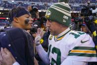 Green Bay Packers' Aaron Rodgers talks to Chicago Bears' Justin Fields after an NFL football game Sunday, Dec. 4, 2022, in Chicago. The Packers won 28-19. (AP Photo/Charles Rex Arbogast)
