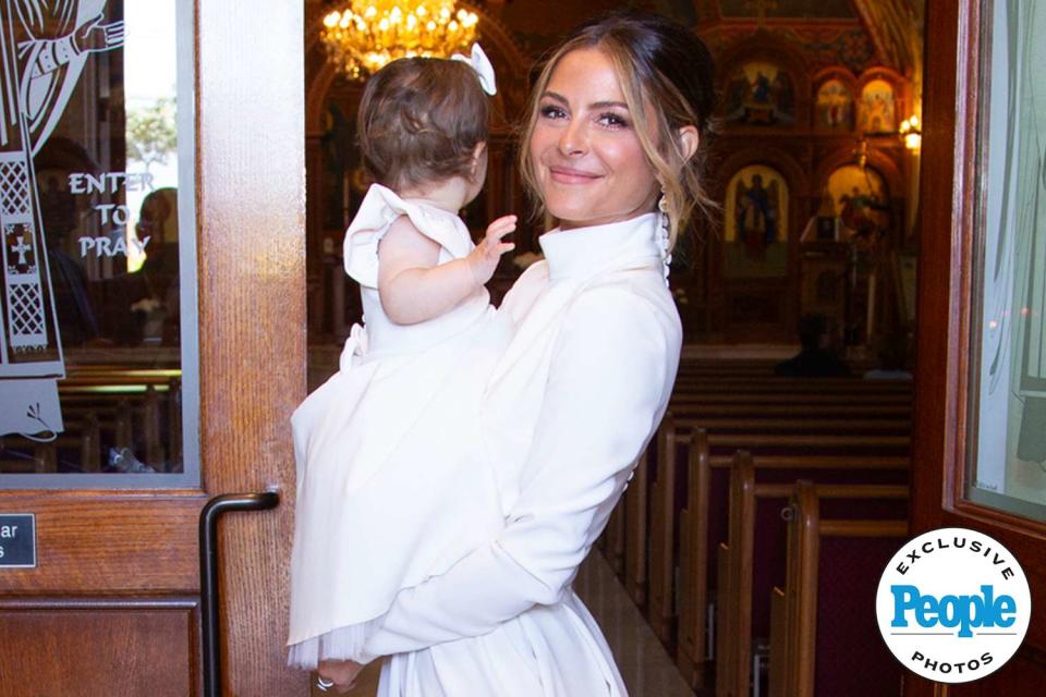 <p>Lauren Cheek</p> Maria Menounos and daughter Athena at her christening.