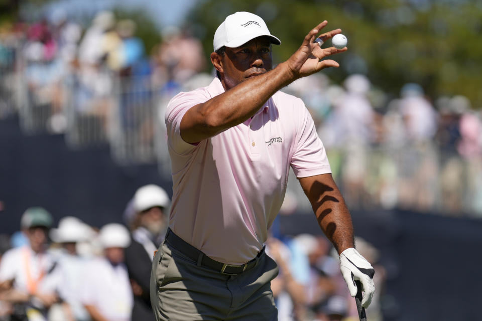 Tiger Woods catch a ball on the ninth hole during a practice round for the U.S. Open golf tournament Tuesday, June 11, 2024, in Pinehurst, N.C. (AP Photo/George Walker IV)