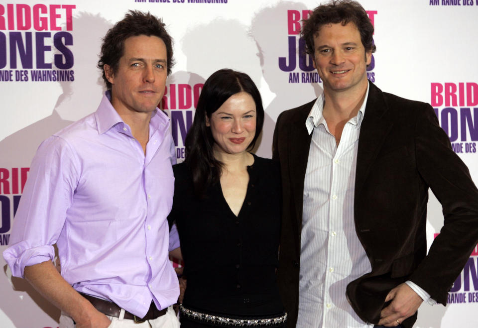 Zellweger, Grant and Firth pose for the media to promote the movie ' Bridget Jones - Beyond the Edge of Reason ' in Berlin.  U.S. actress Renee Zellweger (C) and British actor Hugh Grant and Colin Firth (R) pose for the edia to promote the movie ' Bridget Jones: Beyond the Edge of Reason ' in Berlin November 12, 2004. REUTERS/Michael Dalder