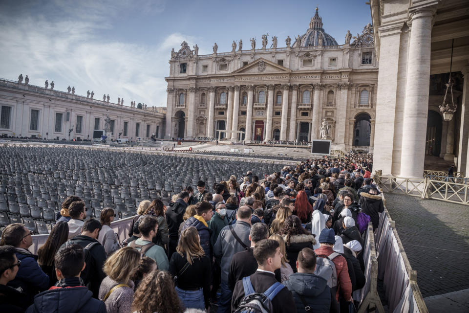 Faithful stand in St. Peter’s Square to bid farewell to the body of the late Pope Emeritus Benedict XVI, who is laid out in public in St. Peter’s Basilica, on Jan. 4, 2023.<span class="copyright">Michael Kappeler—dpa/picture alliance/Getty Images</span>
