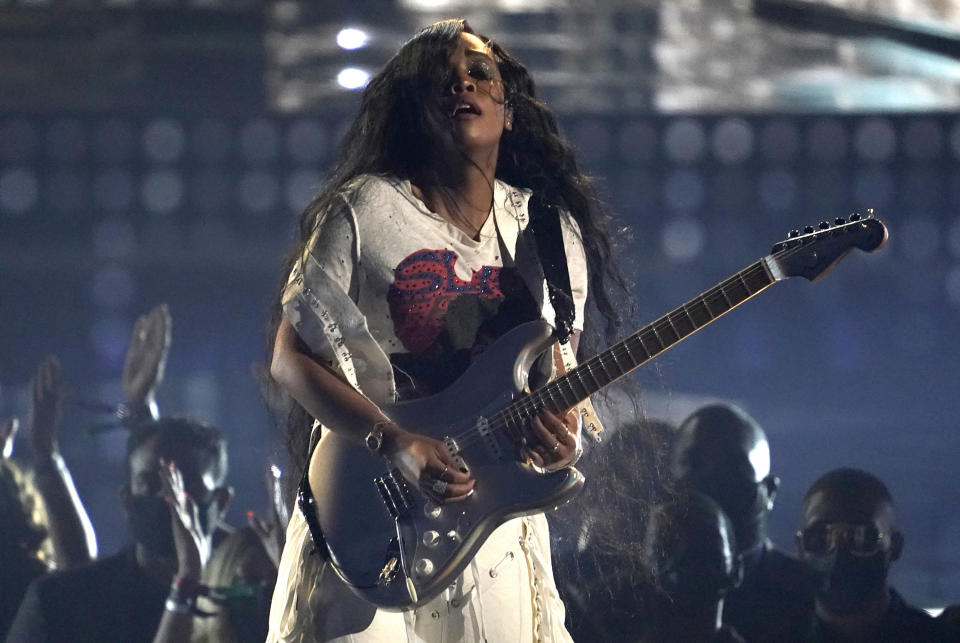 FILE - H.E.R. performs at the BET Awards on June 27, 2021, in Los Angeles. In addition to making great music, the Grammy and Oscar-winning recording artist wants to be an active citizen that empowers young people with information. She gets to do both in the new animated Netflix series, "We the People." (AP Photo/Chris Pizzello, File)