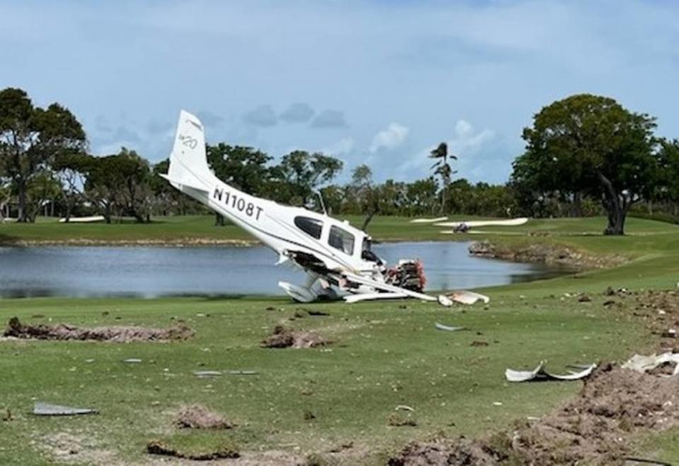 A badly damaged plane is parked on the golf course at Ocean Reef Club in North Key Largo Friday, March 1, 2024.