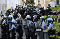 Police clear the area around Lafayette Park and the White House as demonstrators gather to protest the death of George Floyd, Monday, June 1, 2020, in Washington. Floyd died after being restrained by Minneapolis police officers. (AP Photo/Alex Brandon)