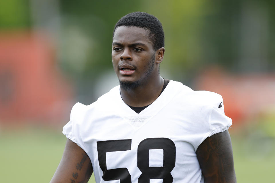 FILE - Cleveland Browns' Isaiah Thomas walks off the field during an NFL football practice at the team's training facility on May 25, 2022, in Berea, Ohio. Second-year ends Alex Wright and Thomas could miss significant time for the Browns with knee injuries. Coach Kevin Stefanski revealed both injuries while providing few other details or a timetable for recovery before practice on Monday, Aug. 7, 2023. (AP Photo/Ron Schwane, File)