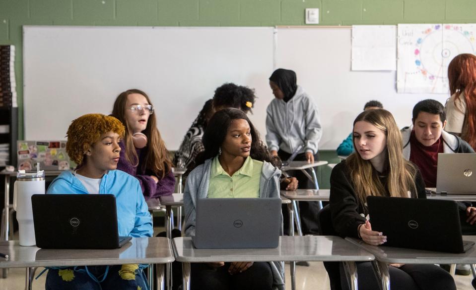 At front: Sa’Ryah Armstrong, Qur’nasia Jones and Breanna Feinstein go over a review of the lessons they’ve learned in Introduction to Computer Science, a dual enrollment class through Stanford University, at Antioch High School in Antioch, Tenn., Thursday, Dec. 7, 2023.