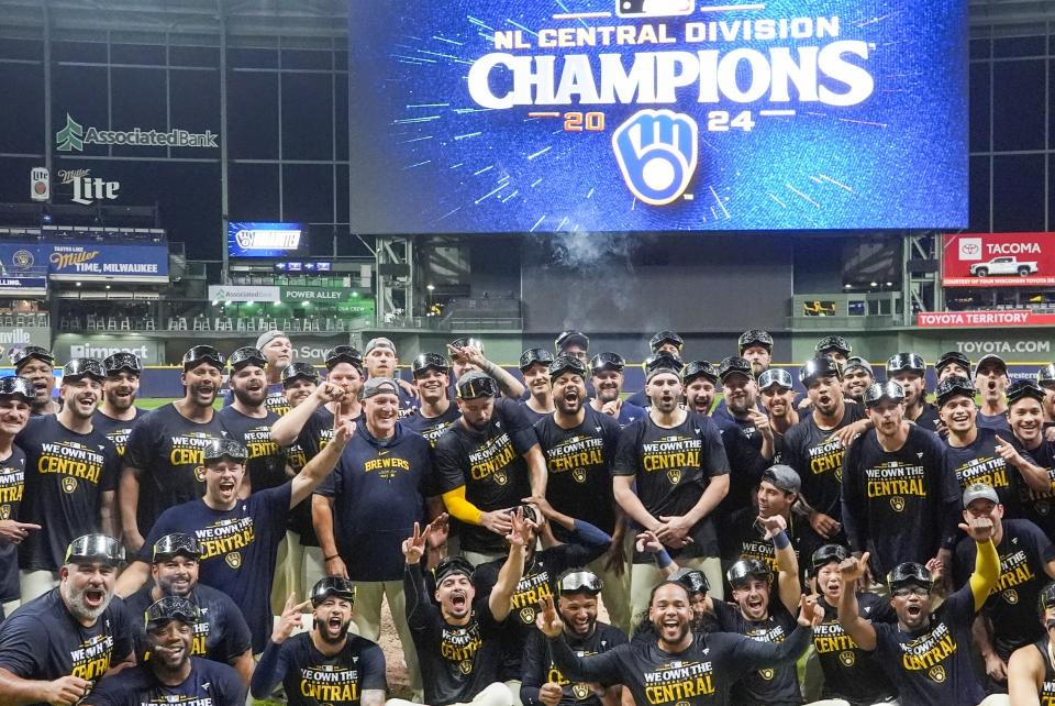 The Milwaukee Brewers celebrate after a baseball game against the Philadelphia Phillies Wednesday, Sept. 18, 2024, in Milwaukee. The Brewers won 2-1 and clinched the National League Central division. (AP Photo/Morry Gash)