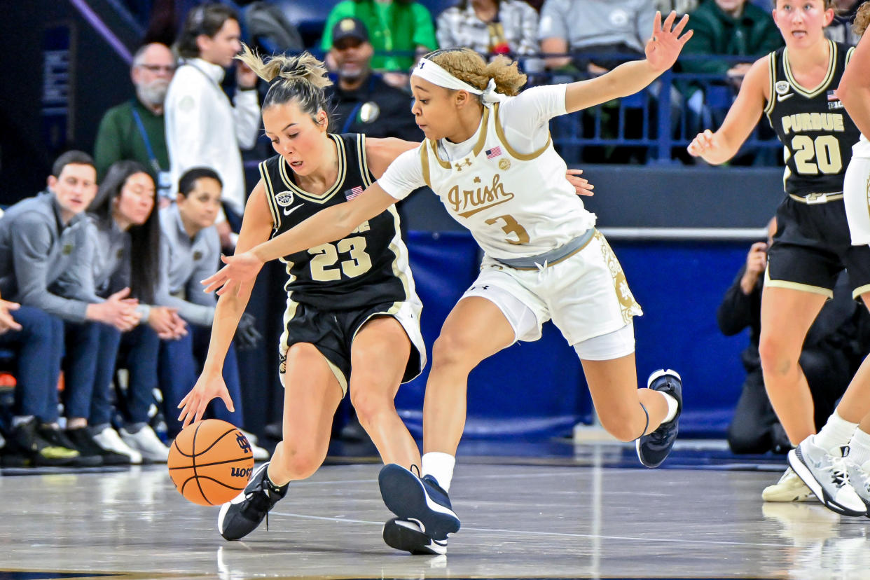 Notre Dame guard Hannah Hidalgo attempts to steal the ball from Purdue guard Abbey Ellis during their game on Dec. 17, 2023, in South Bend, Indiana. (Matt Cashore/USA TODAY Sports)