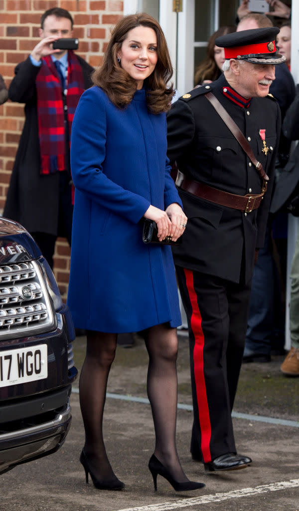 Kate Middleton stuns in Cambridge wearing long blue coat and animal print  dress today