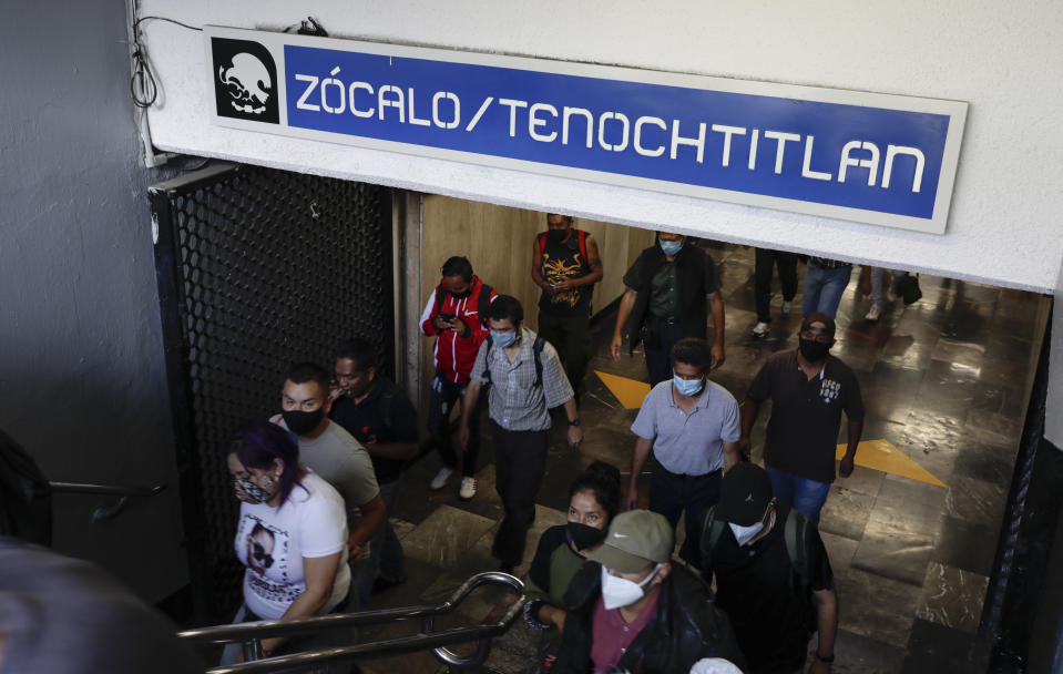 Commuters exit the Zocalo/Tenochtitlan metro station in Mexico City, Tuesday, May 18, 2021. Tenochtitlan, the capital of the Aztec empire, now known as Mexico City, fell after a prolonged siege 500 years ago, marking one of the few times an organized Indigenous army under local command fought European colonizers to a standstill for months, and the final defeat helped set the template for much of the conquest and colonization that came afterward. (AP Photo/Eduardo Verdugo)