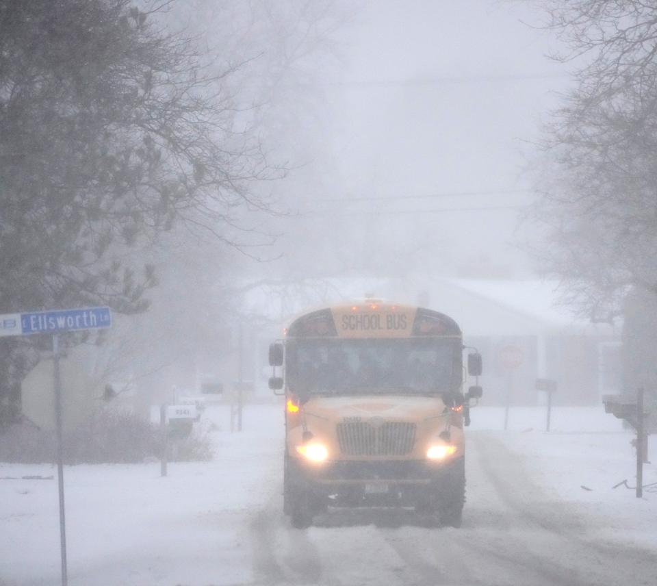 A school bus makes its way through the snow down Rexleigh Drive in Bayside on Wednesday, Feb. 22, 2023. Wisconsin communities were hit with snow, sleet, freezing rain and high winds.