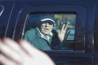 President Donald Trump waves to supporters as he departs after playing golf at the Trump National Golf Club in Sterling Va., Sunday Nov. 8, 2020. (AP Photo/Steve Helber)