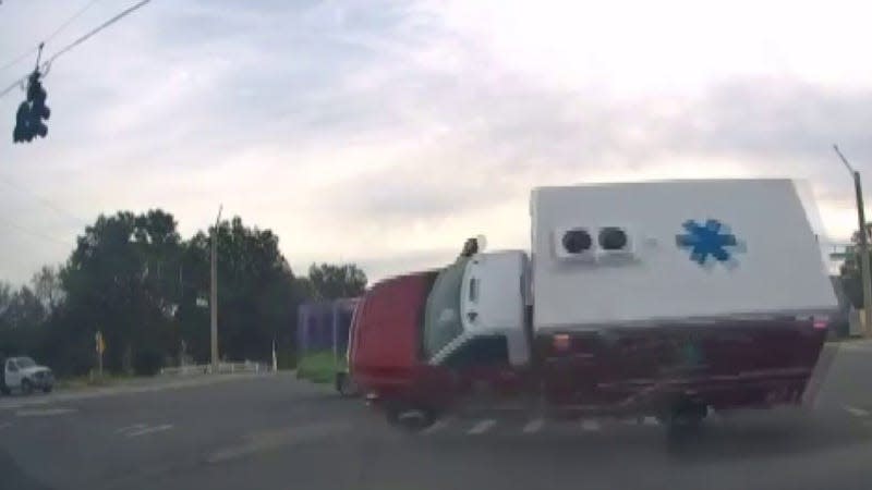 Screenshot of the ambulance flipping after being hit