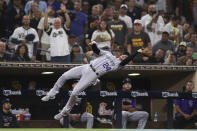 Colorado Rockies third baseman Ryan McMahon makes a catch in foul territory on a ball hit by San Diego Padres' Wil Myers in the fourth inning of a baseball game Friday, July 30, 2021, in San Diego. (AP Photo/Derrick Tuskan)