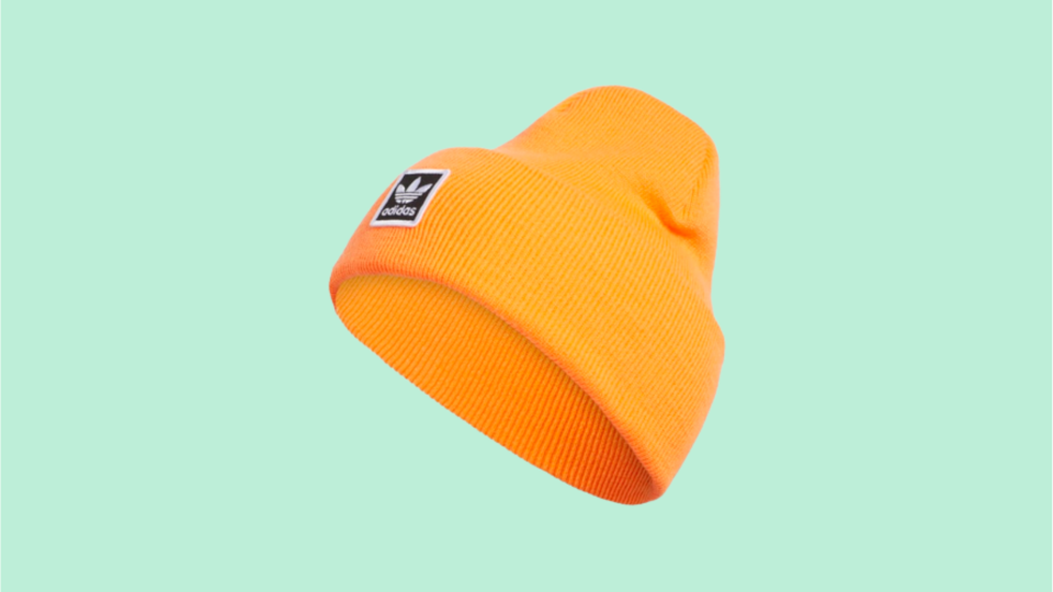 A vibrant beanie is the ultimate pop of color for winter outfits.
