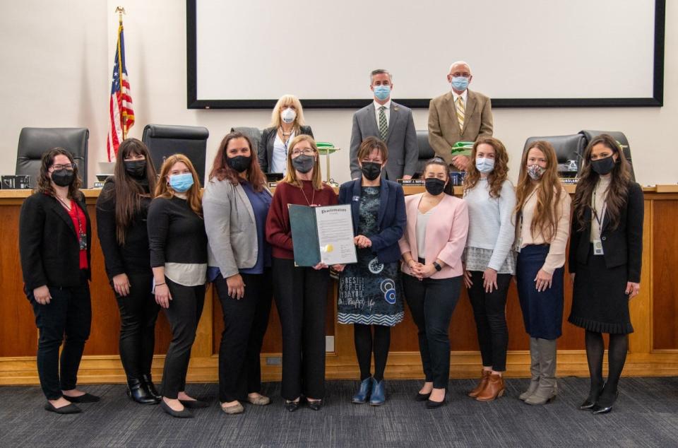 Joining the Bucks County Commissioners (back row, left to right)  Diane Ellis-Marseglia, Bob Harvie and Gene DiGirolamo are members of organizations marking Human Trafficking Awareness Month at the county administration building in Doylestown Wednesday.  They include (front row, from left) Cindy LaBar, Bucks County Drug & Alcohol Commission; Jen Locker, A Woman's Place; Elyse Hoekstra, NOVA: Stephanie Shantz Stiver, NOVA; Julie Dugery, NOVA, Bucks Coalition Against Trafficking co-chair; Penny Ettinger, NOVA; Jenna Spadaro, NOVA; Brooke Engelbart, Worthwhile Wear; Kelly Teel, Bucks County Children and Youth; andChelsey Jackman, County of Bucks Law Department.