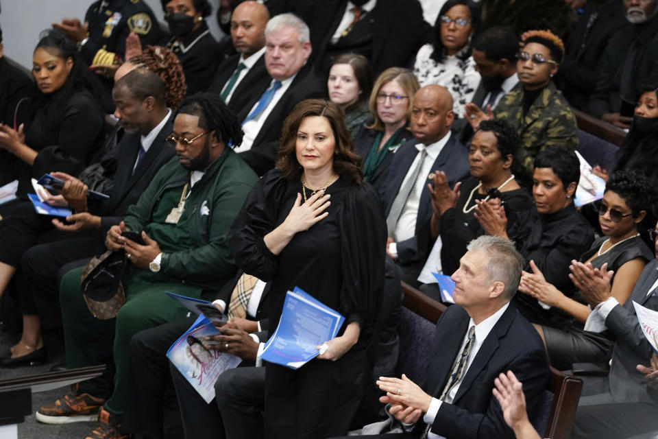 Gov. Gretchen Whitmer stands at the funeral for Michigan State University shooting victim Arielle Anderson in Detroit, Tuesday, Feb. 21, 2023. Anderson, Alexandria Verner and Brian Fraser and were killed and several other students injured after a gunman opened fire on the campus of Michigan State University. (AP Photo/Paul Sancya)