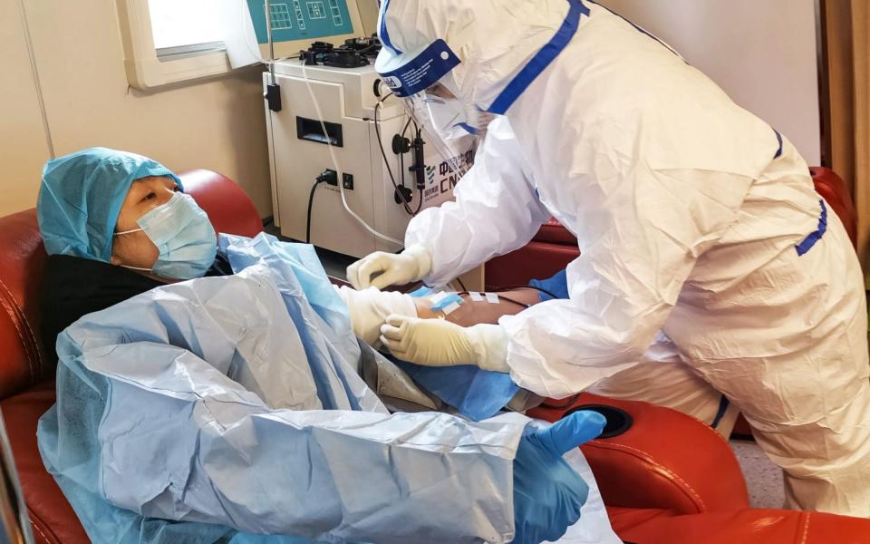 A person, who has recovered from the COVID-19 coronavirus infection, donates plasma in Zouping in China's eastern Shandong province -  STR / AFP