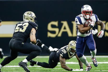 Sep 17, 2017; New Orleans, LA, USA; New England Patriots running back James White (28) runs past New Orleans Saints cornerback P.J. Williams (26) and linebacker A.J. Klein (53) during the second quarter of a game at the Mercedes-Benz Superdome. Derick E. Hingle-USA TODAY Sports