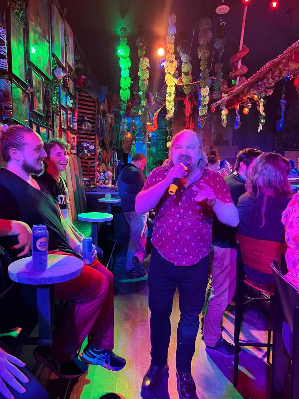 Tony Wilson takes a turn at the mic at his karaoke night at Tiki Tiki Bang Bang.