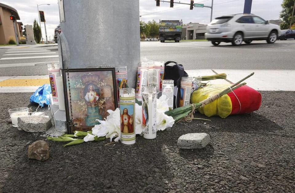 A roadside memorial is near where Leonel Birrueta, 31, of Kennewick, was killed on his moped at West Clearwater Avenue at Edison Street.