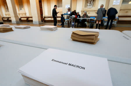 Ballot envelopes and ballot papers are seen on a table at a polling station in the first round of 2017 French presidential election in Lyon, France, April 23, 2017. REUTERS/Robert Pratta