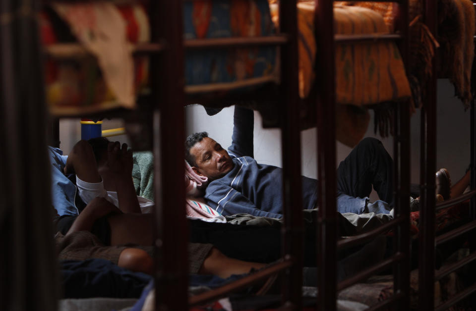 In this May 12, 2012 photo, Central American migrants rest at a migrant shelter while waiting for a northern bound train in Lecheria, on the outskirts of Mexico City. While the number of Mexicans heading to the U.S. has dropped dramatically, a surge of Central American migrants is making the 1,000-mile northbound journey this year, fueled in large part by the rising violence brought by the spread of Mexican drug cartels. (AP Photo/Marco Ugarte)