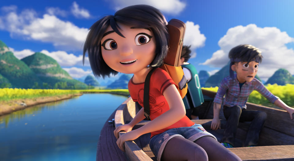 This image released by DreamWorks Animation shows characters, Yi, voiced by Chloe Bennet, left, and Jin, voiced by Tenzing Norgay Trainor, in a scene from "Abominable," in theaters on Sept. 27. (DreamWorks Animation LLC. via AP)