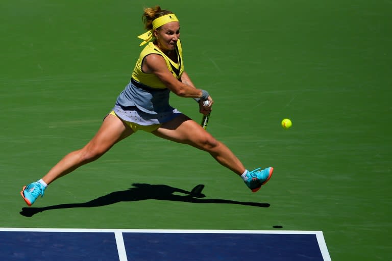 Svetlana Kuznetsova of Russia returns a shot to Elena Vesnina of Russia on March 19, 2017 in Indian Wells, California