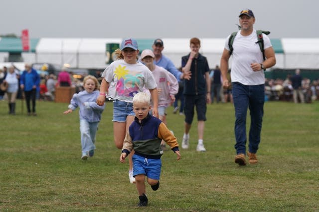 Mike Tindall with his children Mia (centre), Lena (left) and Lucas (front) at the Defender Burghley Horse Trials at Burghley House near Stamford, Lincolnshire, 