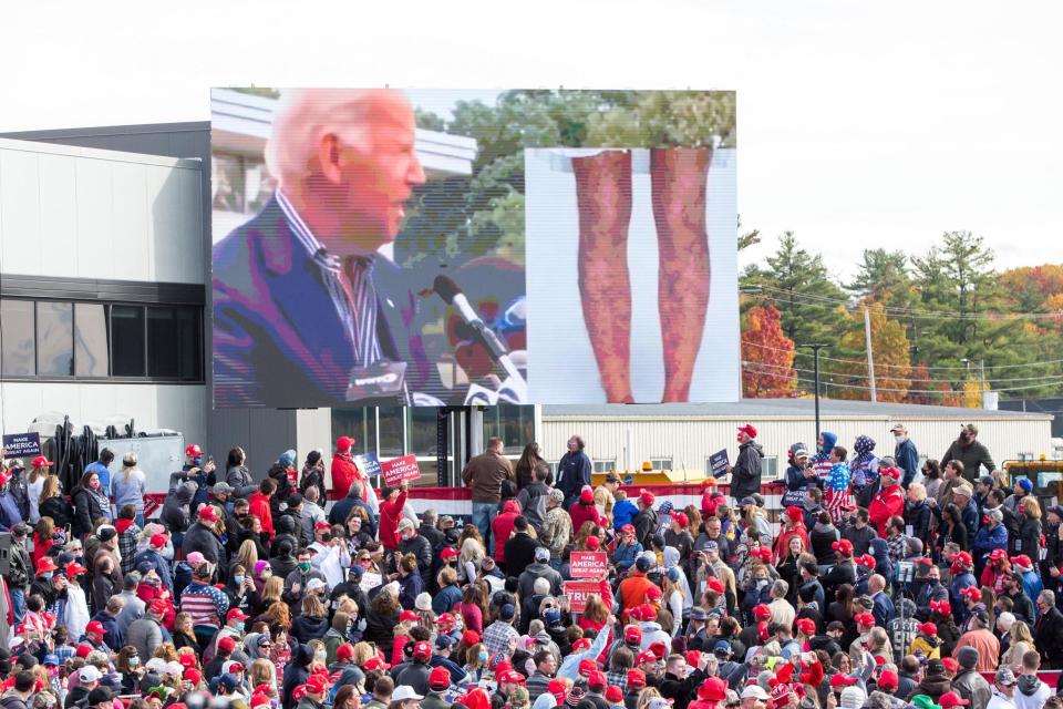 A video screen broadcasts footage of Democratic presidential nominee Joe Biden during a President Donald Trump campaign rally on Sunday (Getty Images)