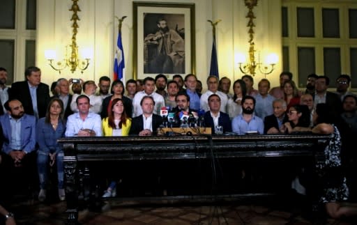 Chilean lawmakers at a press conference after reaching an agreement on holding a referendum to change the constitution, a key demand of protesters during a month of violent unrest