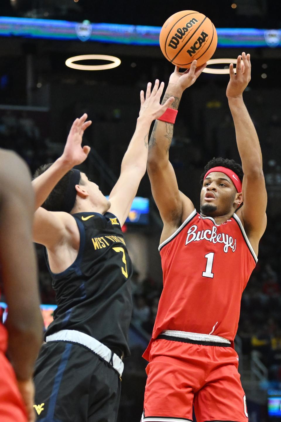 Dec 30, 2023; Cleveland, Ohio, USA; Ohio State Buckeyes guard Roddy Gayle Jr. (1) shoots over the defense of West Virginia Mountaineers guard Kerr Kriisa (3) during the first half at Rocket Mortgage FieldHouse. Mandatory Credit: Ken Blaze-USA TODAY Sports