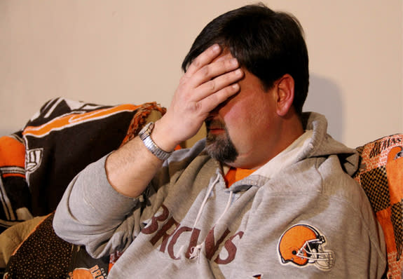 Ryan Arledge of Ashville, Ohio, reacts while watching his favorite football team on television. While Arledge considers himself a die-hard fan, he says he knows where to draw the line emotionally — but experts at The Ohio State University Wexne