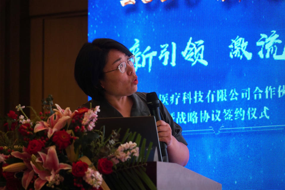 Zhao Baihui, CEO of Shanghai-based testing kit company BioGerm, speaks during a corporate event at a trade fair in Nanchang in eastern China's Jiangxi province on Saturday, Aug. 22, 2020. BioGerm was one of three companies that gained privileged access to crucial information on the coronavirus from the Chinese Center for Disease Control and Prevention at the beginning of the outbreak, allowing them to make kits ahead of competitors. The move delayed China's response to the outbreak and caused critical shortages of kits. (AP Photo/Dake Kang)