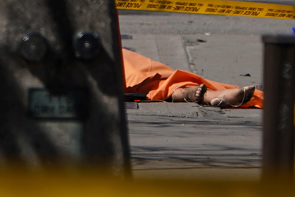 <p>The feet of a victim are pictured at the scene of an incident where a van struck multiple people on Yonge Street in Toronto, Ontario, Canada, April 23, 2018. (Photo: Carlo Allegri/Reuters) </p>