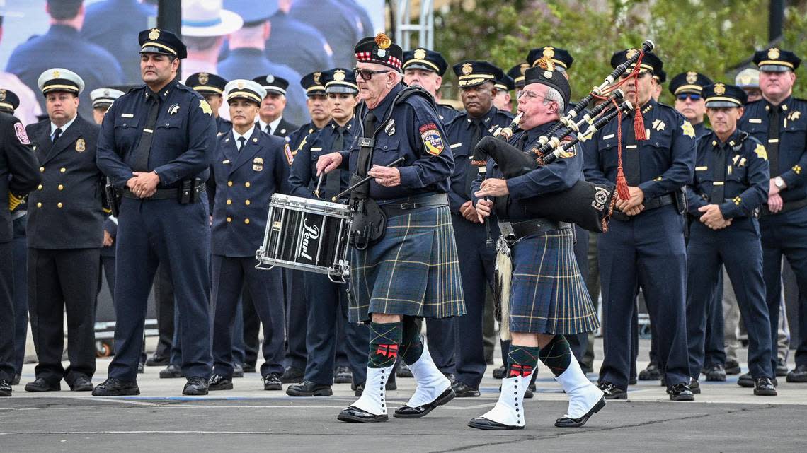 Bagpipes and drums are played as officers from the Fresno Police Department stand in formation during the 21st anniversary September 11 Memorial Ceremony at the California 9/11 Memorial in Clovis on Sunday, Sept. 11, 2022.