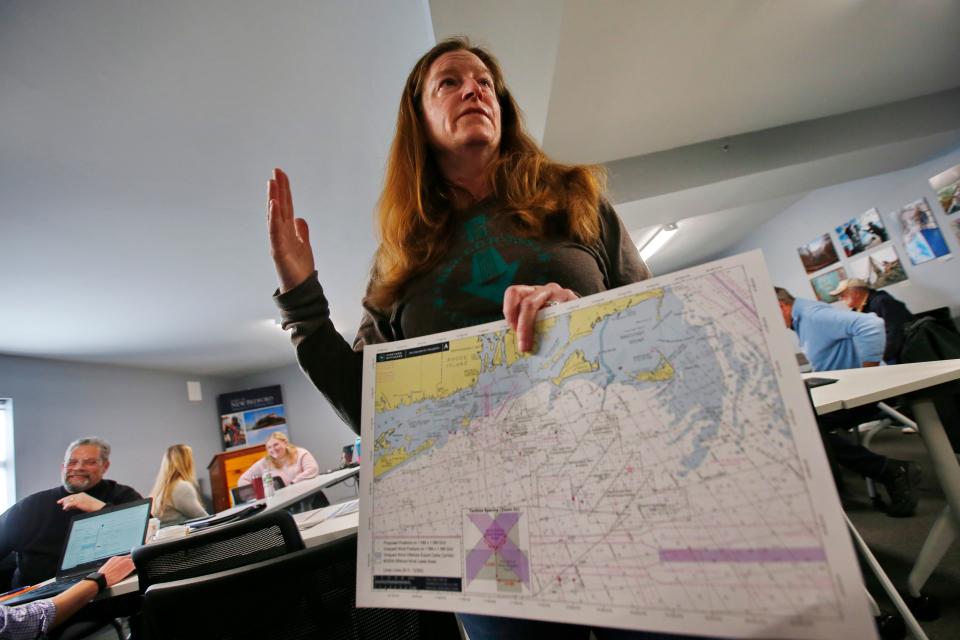 Crista Bank, Vineyard Wind Fisheries Liaison, speaks at an event held at the New Bedford Port Authority building in New Bedford where fishermen could enroll in the Vineyard Wind Fisheries Compensation Program.