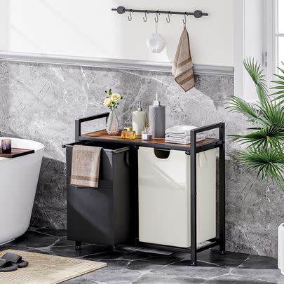 A genius laundry hamper organizer with a top shelf for decor and other supplies