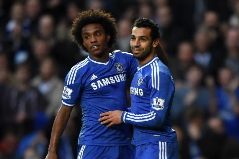 Chelsea's Willian celebrates Mohamed Salah winning a penalty.