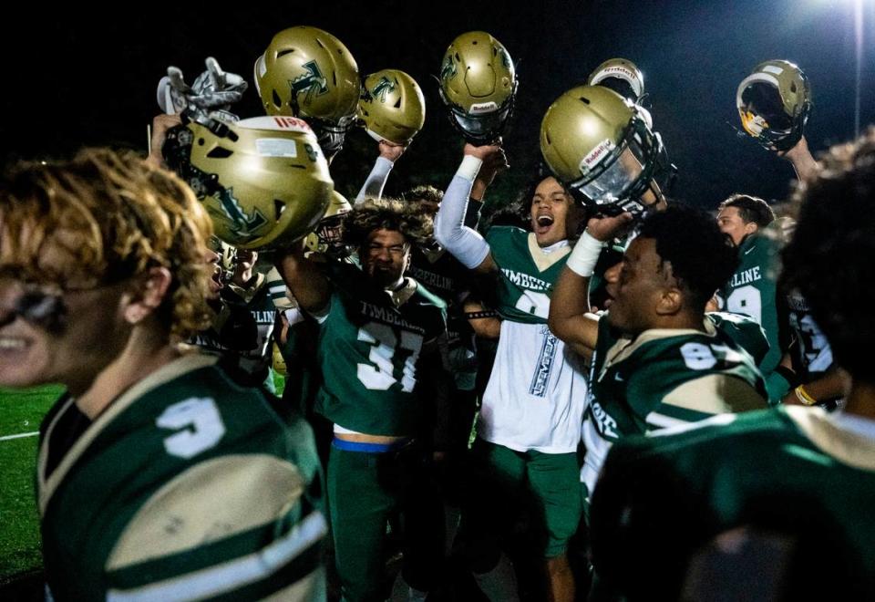 Timberline players celebrate during a huddle after the game where they defeated Gig Harbor 36-34 in overtime at the Roy Anderson Field in Purdy, Wash. on Sept. 29, 2022.