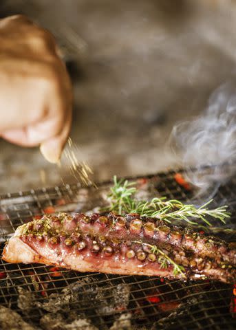 <p>COURTESY OF KALESMA MYKONOS</p> A dish of chargrilled octopus, an island staple