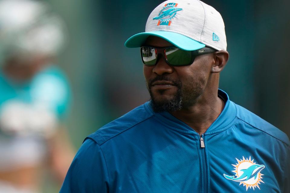 Brian Flores walks onto the field during Dolphins practice on Aug. 4, 2021.