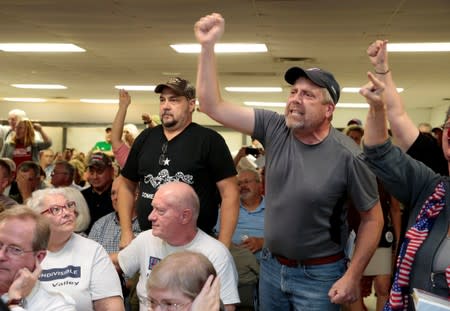 Guns rights advocates react during a "End The Gun Violence" Town Hall hosted by U.S. Congresswoman Stevens in Michigan