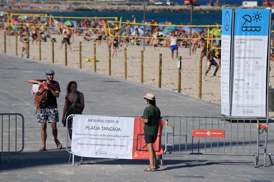 Beaches reached capacity in Barcelona on Sunday - Getty