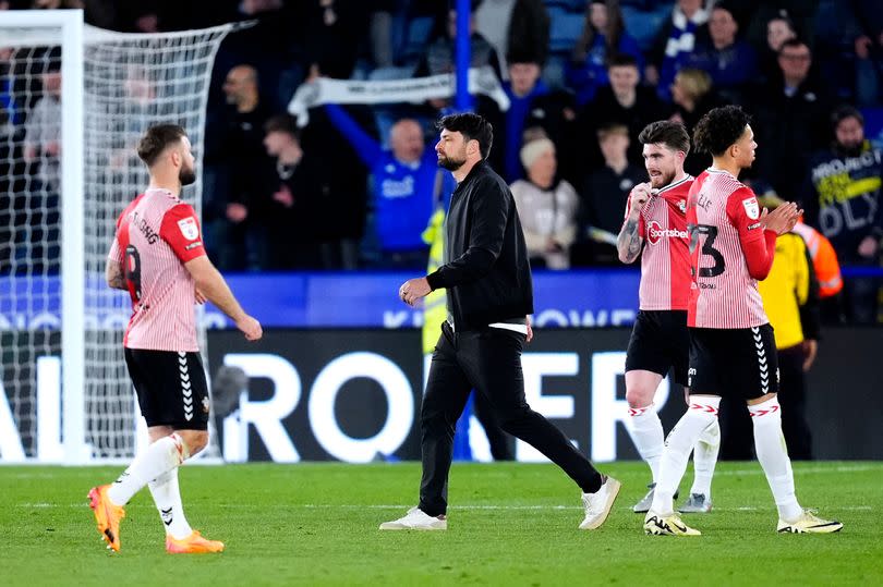 Southampton manager Russell Martin, centre, at the end of their 5-0 hammering to Leicester City -Credit:PA