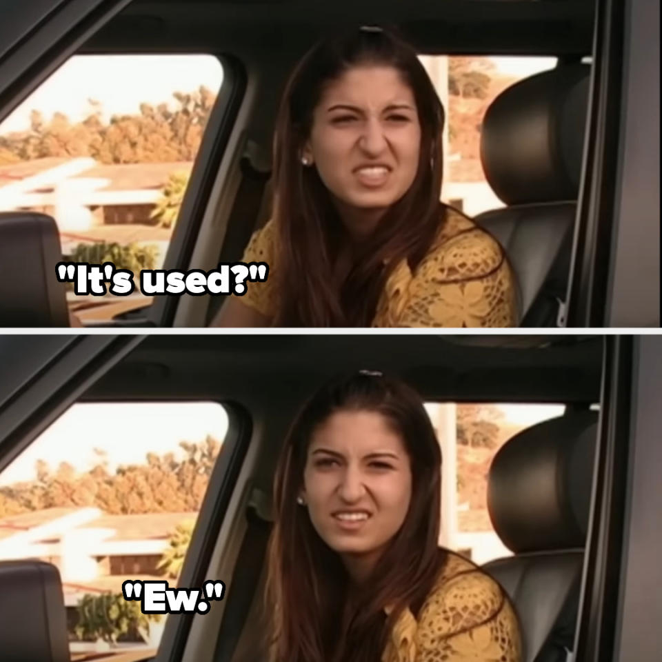 Woman expressing disgust inside a car with text overlay saying "It's used?" and "Ew."