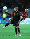 KHARKOV, UKRAINE - JUNE 17: Raul Meireles (R) of Portugal battles for the ball with Nigel de Jong of Netherlands during the UEFA EURO 2012 group B match between Portugal and Netherlands at Metalist Stadium on June 17, 2012 in Kharkov, Ukraine. (Photo by Ian Walton/Getty Images)